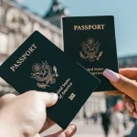 Two passports held up