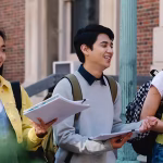 Three university students walking on campus