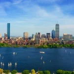 Image of a body of water with tall skyscrapers behind it