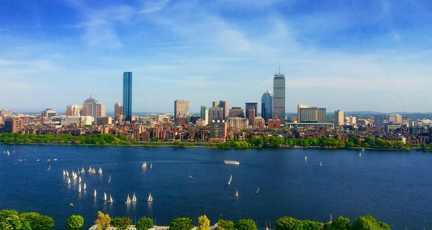 Image of a body of water with tall skyscrapers behind it