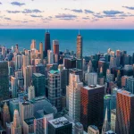 Image of tall skyscraper buildings with Lake Michigan in the background
