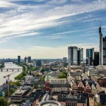 City skyline of Frankfurt, with a river flowing down the left hand side of the image