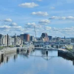Image of a river with modern buildings either side
