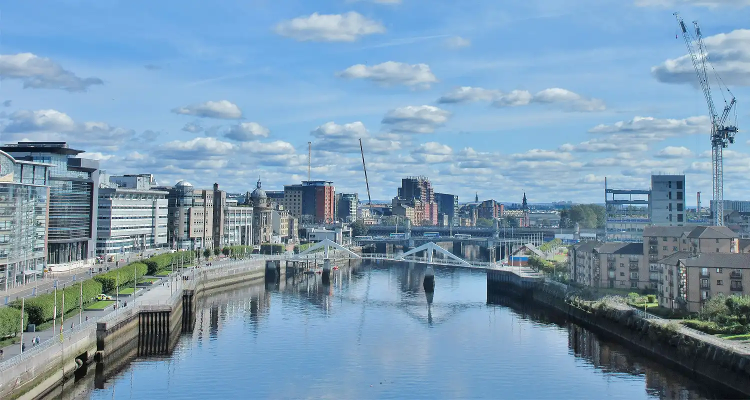 Image of a river with modern buildings either side