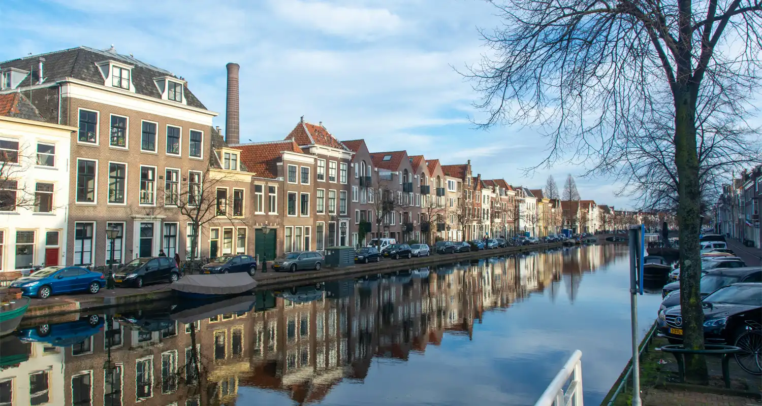 Image of a canal with houses next to it