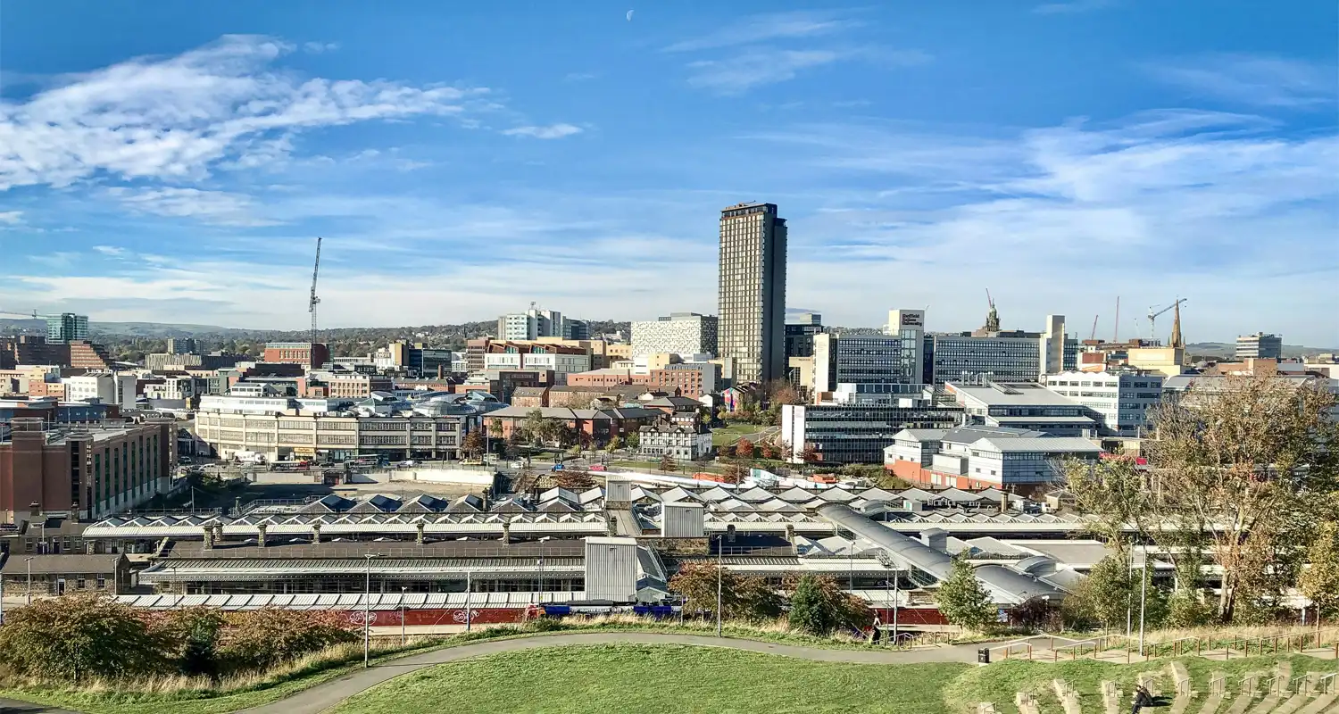 Image of a city skyline with a large skyscraper in the centre