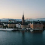 Image of buildings next to a body of water