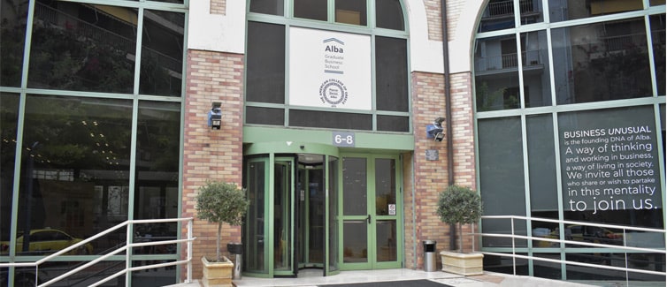 Image of a building with a door and large windows