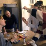 A group of people gathered around a table