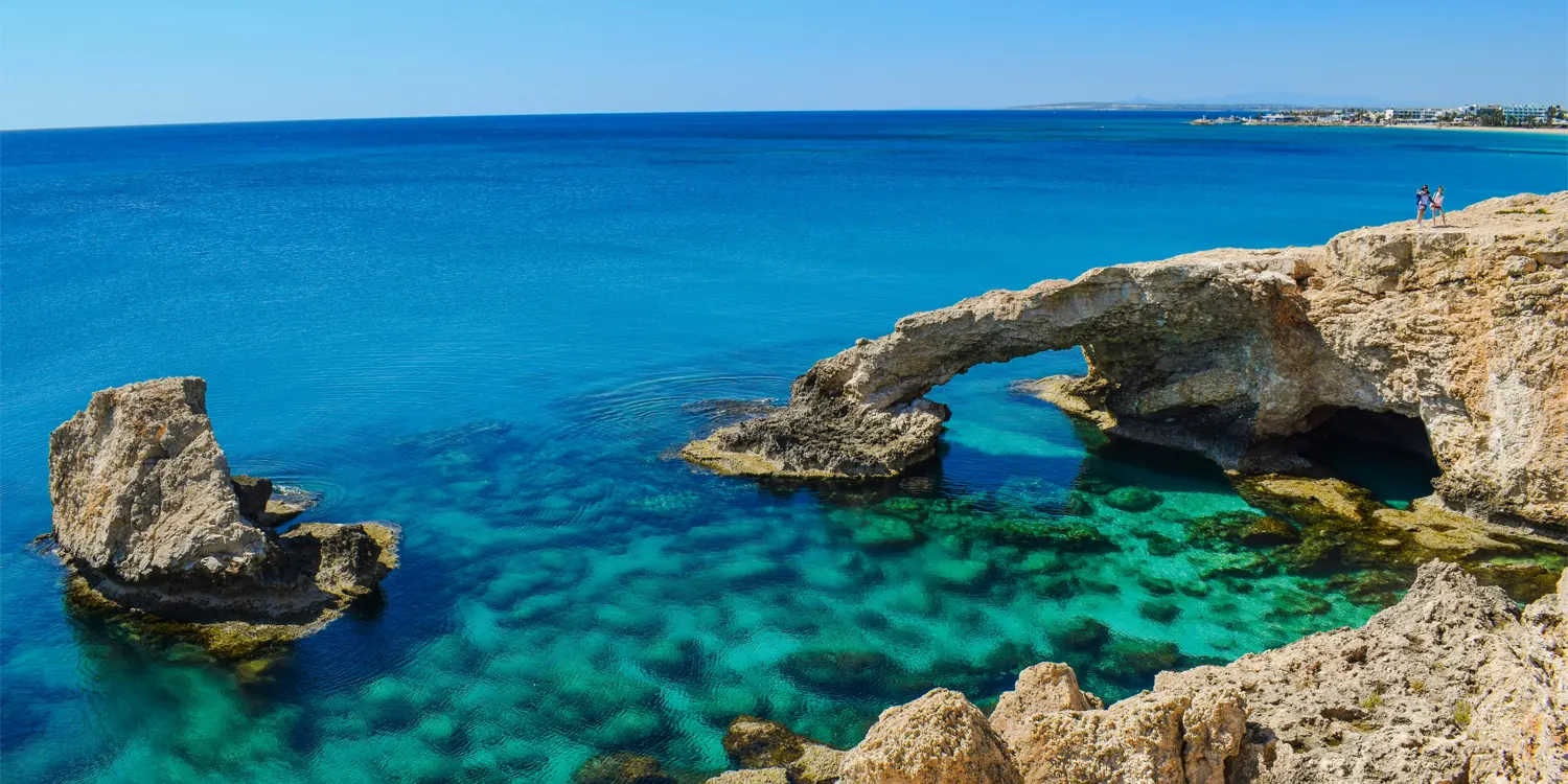 Bright blue sea with rock formations sticking out of it