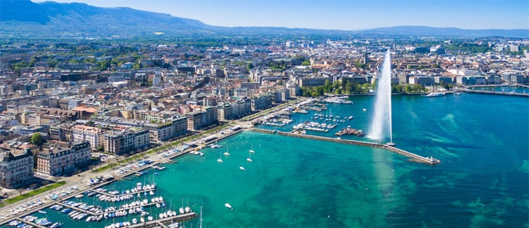 Image of a city coastline with a large fountain in the middle