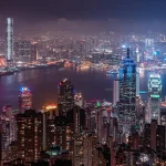 City skyline at night with several skyscrapers