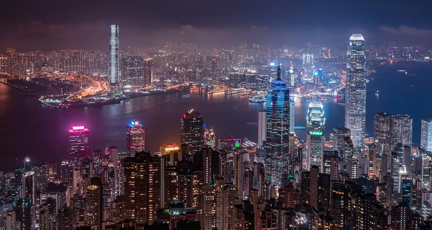 City skyline at night with several skyscrapers