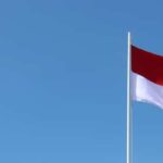 Image of the Indonesian flag flying on a flagpole