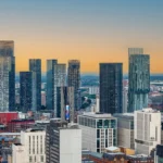City skyline with tall buildings in the middle of the image