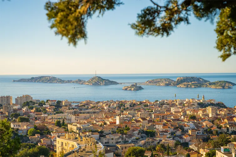 Panoramic view of the city of Marseille with a clear view of the Mediterranean Sea and nearby islands