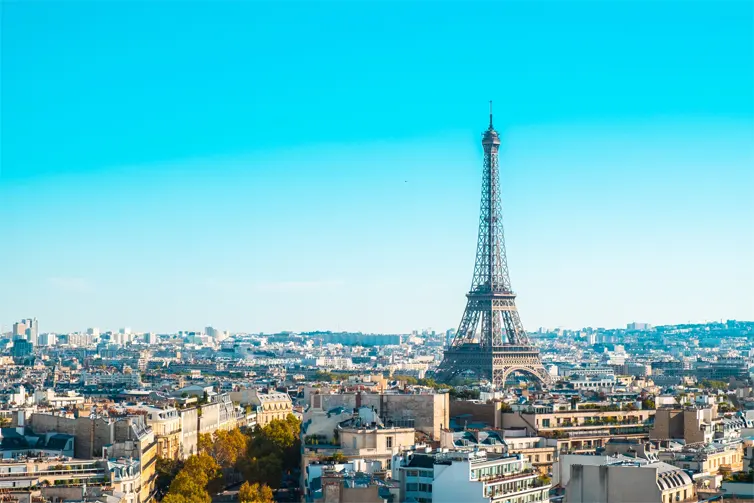 A large tower above a city skyline