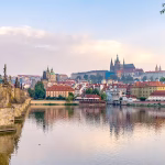 Brick built bridge leading over water to a historic old town