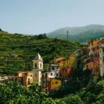 Colourful houses on a green hill