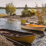 Boats sitting on an open lake