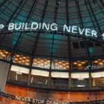 The roof of a building with LED lights hanging down.