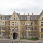 Sandstone coloured building in a typical Belgian style